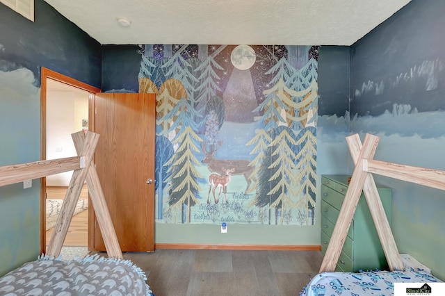 1015 Ridge Rd, Hickman, NE 68372 - bedroom with wood finished floors and a textured ceiling