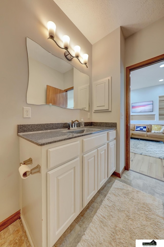 1015 Ridge Rd, Hickman, NE 68372 - bathroom with vanity and a textured ceiling
