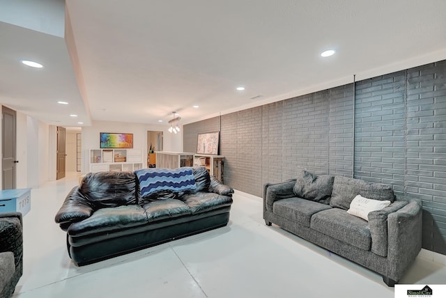 1015 Ridge Rd, Hickman, NE 68372 - living area featuring recessed lighting, concrete floors, and brick wall