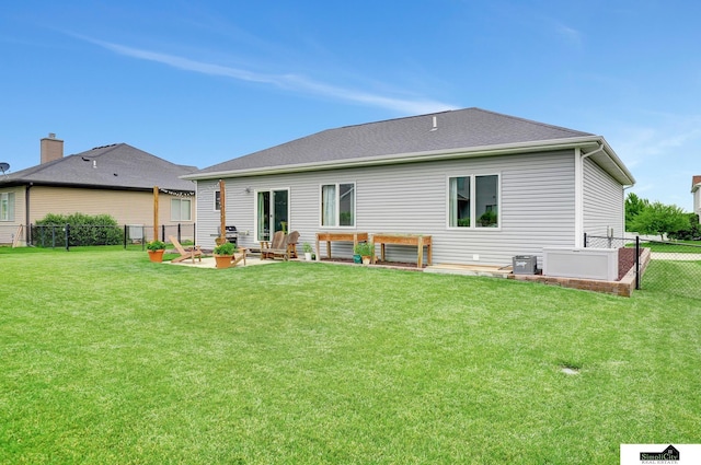 1015 Ridge Rd, Hickman, NE 68372 - back of property with a fenced backyard and a patio