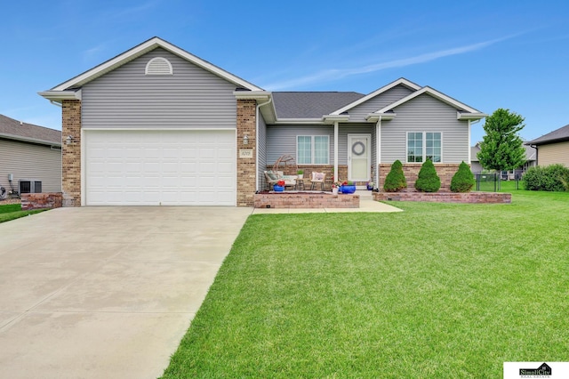 1015 Ridge Rd, Hickman, NE 68372 - ranch-style home featuring driveway, brick siding, a front yard, a garage, and roof with shingles