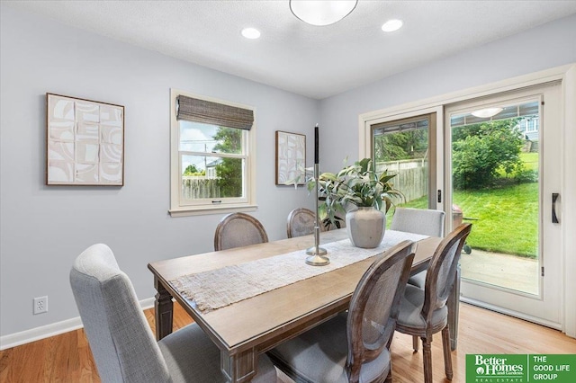12079 Westover Rd, Omaha, NE 68154 - dining area with healthy amount of natural light, light wood finished floors, and recessed lighting