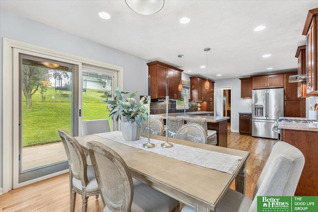 12079 Westover Rd, Omaha, NE 68154 - dining space with light wood-style flooring and recessed lighting