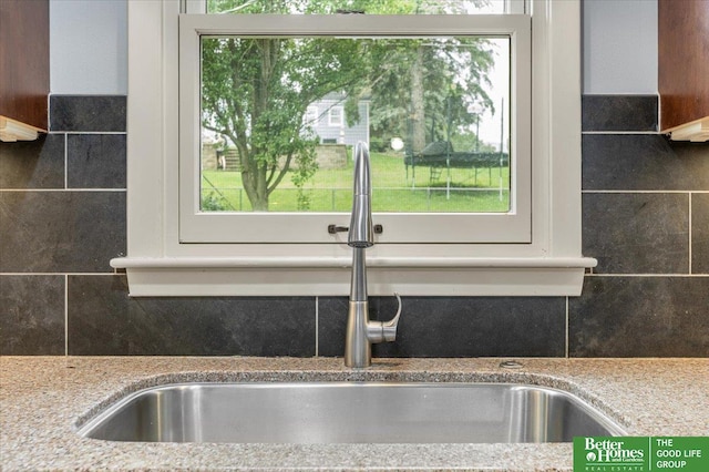 12079 Westover Rd, Omaha, NE 68154 - kitchen view of decorative backsplash and light stone countertops