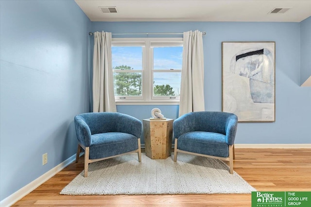 12079 Westover Rd, Omaha, NE 68154 - sitting room featuring wood finished floors and baseboards