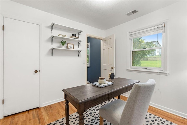 12079 Westover Rd, Omaha, NE 68154 - home office featuring light wood-type flooring and baseboards