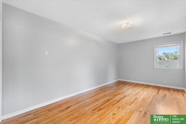 12079 Westover Rd, Omaha, NE 68154 - unfurnished room featuring wood finished floors and baseboards