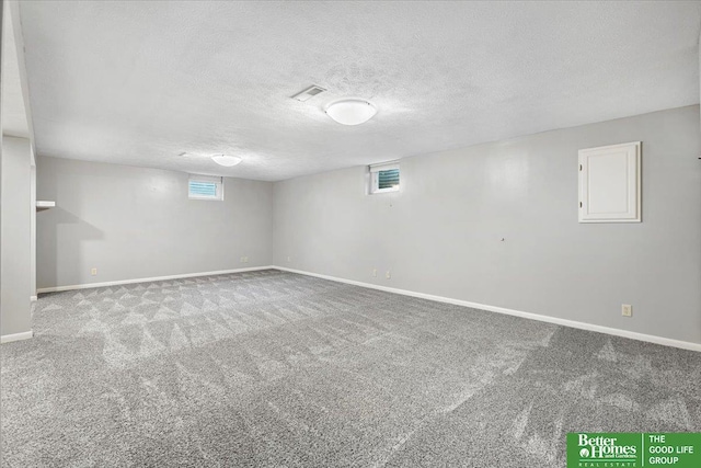 12079 Westover Rd, Omaha, NE 68154 - basement featuring carpet flooring and a textured ceiling