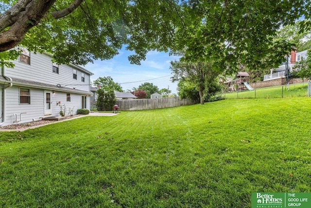 12079 Westover Rd, Omaha, NE 68154 - fenced backyard with a playground and a patio