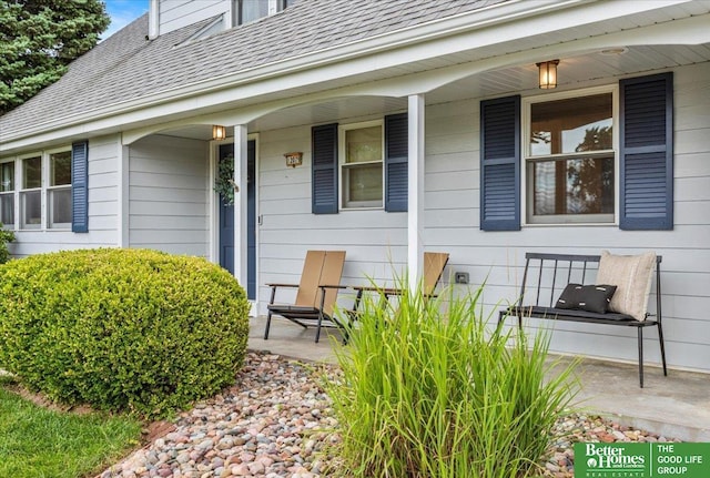12079 Westover Rd, Omaha, NE 68154 - doorway to property featuring covered porch and a shingled roof