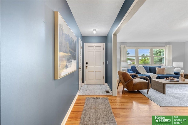 12079 Westover Rd, Omaha, NE 68154 - entrance foyer with baseboards and light wood-style flooring