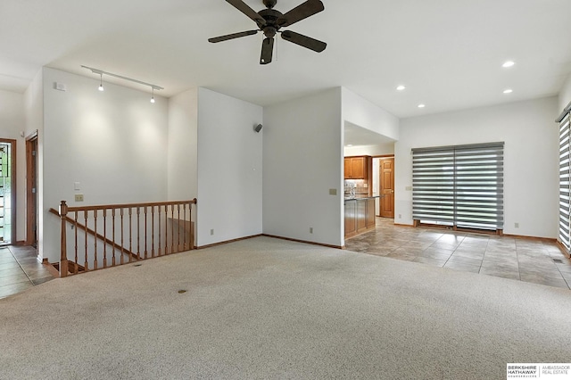 10505 S 179th St, Omaha, NE 68136 - empty room featuring light colored carpet, recessed lighting, light tile patterned floors, ceiling fan, and rail lighting