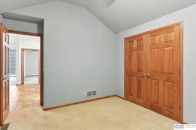 10505 S 179th St, Omaha, NE 68136 - unfurnished bedroom featuring lofted ceiling, light colored carpet, and a closet