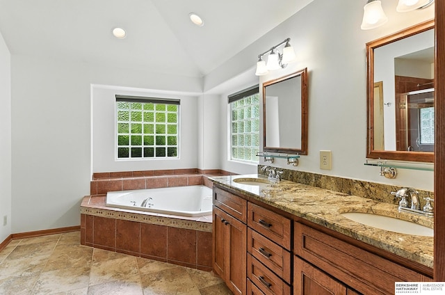 10505 S 179th St, Omaha, NE 68136 - full bath featuring vaulted ceiling, a tub with jets, double vanity, a shower stall, and recessed lighting