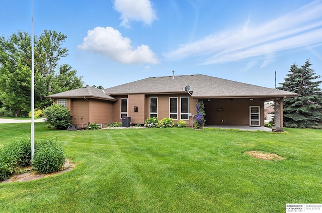 10505 S 179th St, Omaha, NE 68136 - back of property with a patio area, a lawn, and a shingled roof