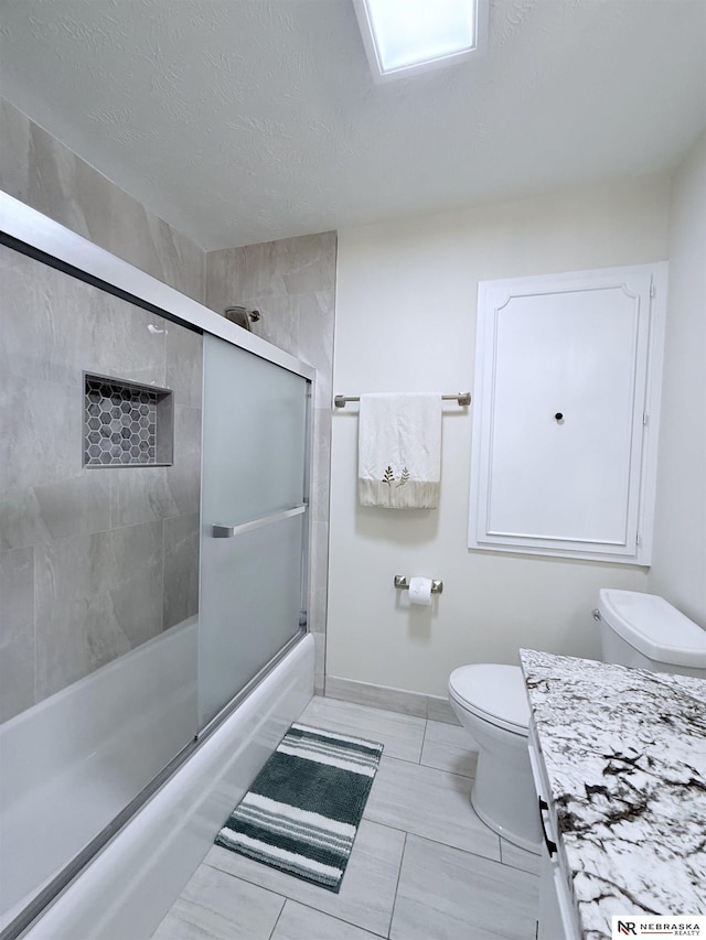 13910 Shirley St, Omaha, NE 68144 - full bathroom with vanity, combined bath / shower with glass door, and a textured ceiling
