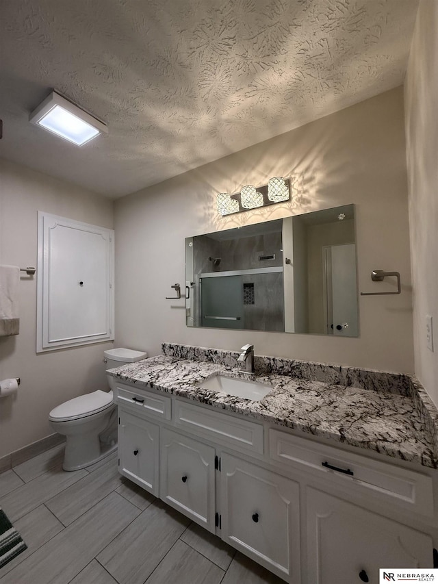 13910 Shirley St, Omaha, NE 68144 - full bathroom featuring vanity, a stall shower, and a textured ceiling