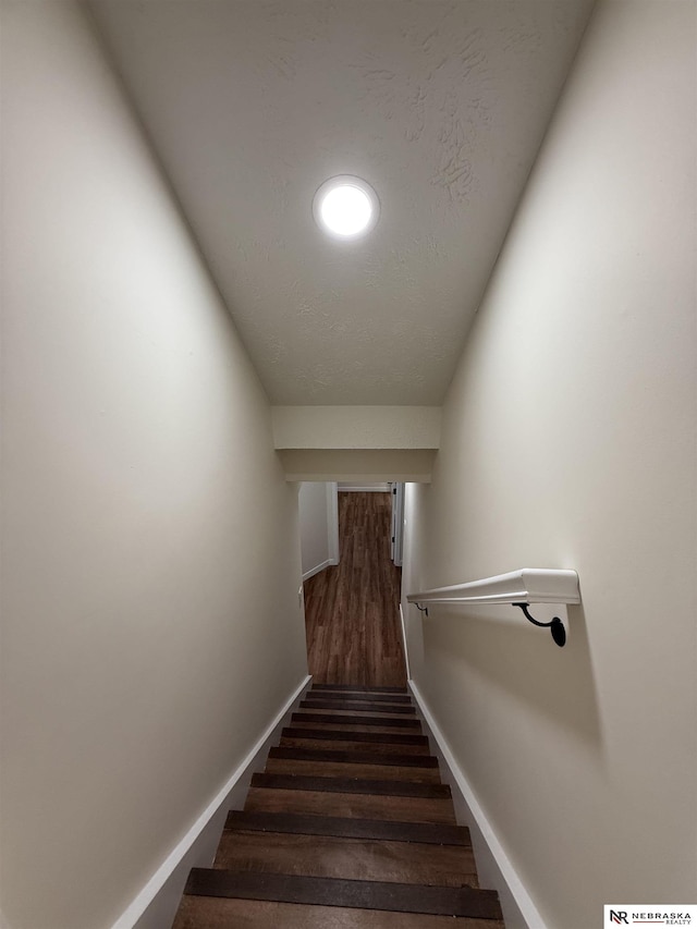 13910 Shirley St, Omaha, NE 68144 - stairway featuring wood finished floors and baseboards