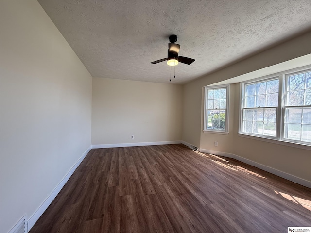 13910 Shirley St, Omaha, NE 68144 - unfurnished room with dark wood-type flooring, a textured ceiling, and a ceiling fan