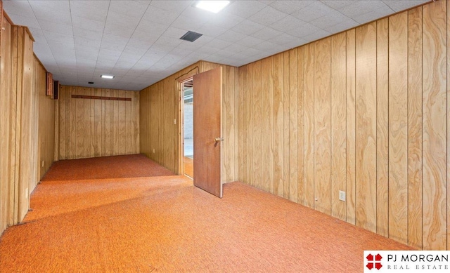 625 S 67th St, Omaha, NE 68106 - carpeted empty room featuring wooden walls