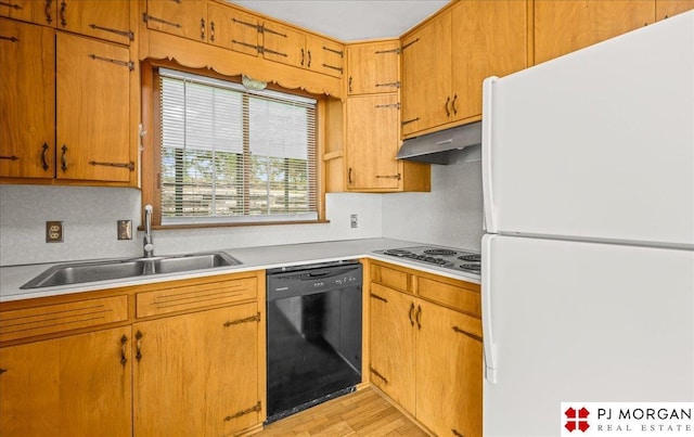 625 S 67th St, Omaha, NE 68106 - kitchen with freestanding refrigerator, black dishwasher, stainless steel electric cooktop, light countertops, and under cabinet range hood
