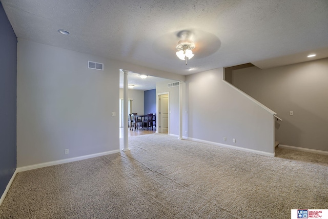 1215 Turtle Creek Rd, Lincoln, NE 68521 - unfurnished living room with carpet floors, stairway, ceiling fan, a textured ceiling, and recessed lighting