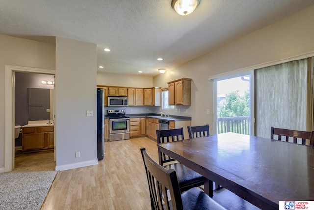 1215 Turtle Creek Rd, Lincoln, NE 68521 - dining area featuring light wood-style floors, recessed lighting, and a textured ceiling