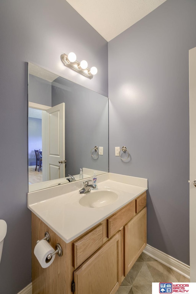 1215 Turtle Creek Rd, Lincoln, NE 68521 - half bathroom with vanity and tile patterned floors
