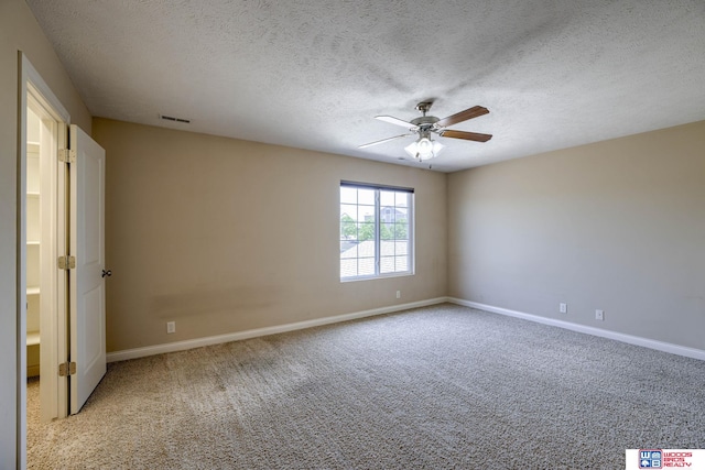 1215 Turtle Creek Rd, Lincoln, NE 68521 - unfurnished room with ceiling fan, carpet, and a textured ceiling
