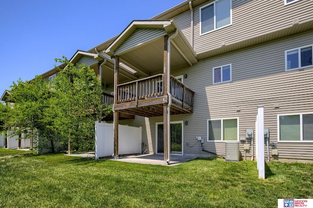 1215 Turtle Creek Rd, Lincoln, NE 68521 - back of house featuring a lawn, a patio area, and a deck