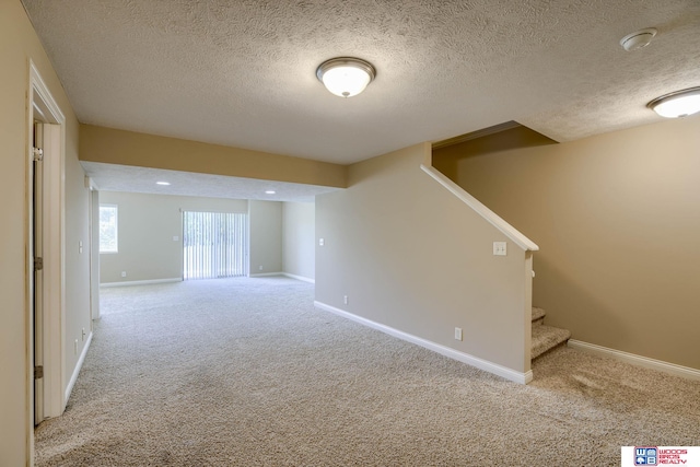 1215 Turtle Creek Rd, Lincoln, NE 68521 - below grade area with stairs, a textured ceiling, and carpet