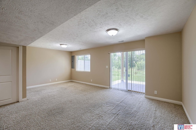 1215 Turtle Creek Rd, Lincoln, NE 68521 - carpeted empty room featuring baseboards and a textured ceiling
