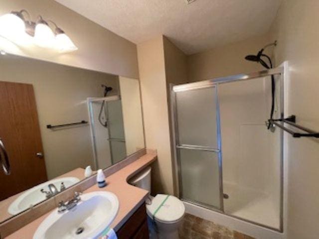 220 Orchard Pl, Hickman, NE 68372 - bathroom featuring a stall shower and vanity