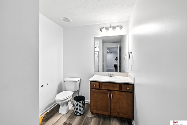 20459 C St, Omaha, NE 68022 - bathroom featuring wood finished floors, vanity, and a textured ceiling