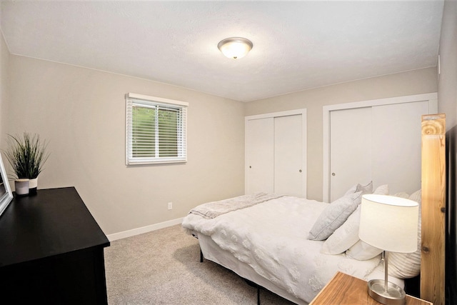 1913 Winnie Dr Unit 5, Bellevue, NE 68005 - bedroom featuring multiple closets and carpet flooring