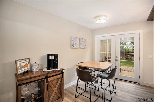 1913 Winnie Dr Unit 5, Bellevue, NE 68005 - dining space featuring light wood-style floors and french doors