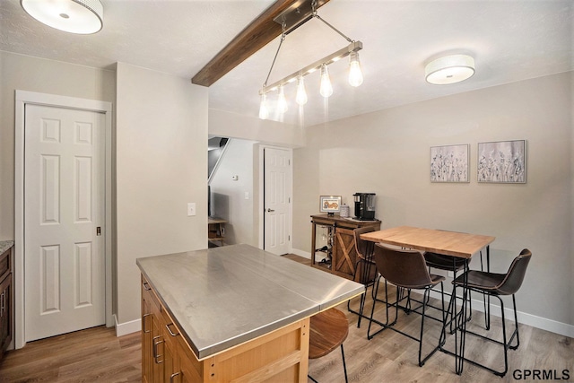 1913 Winnie Dr Unit 5, Bellevue, NE 68005 - kitchen featuring stainless steel counters, light wood-type flooring, and a kitchen island