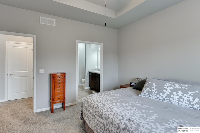 14562 Potter Cir, Bennington, NE 68007 - bedroom with light carpet and connected bathroom