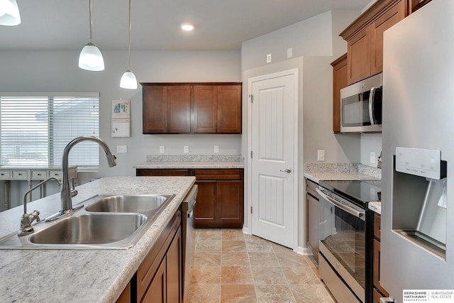 14562 Potter Cir, Bennington, NE 68007 - kitchen featuring appliances with stainless steel finishes, decorative light fixtures, and light countertops