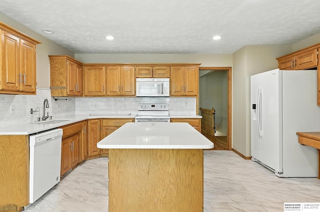1422 N 155th Ave, Omaha, NE 68154 - kitchen featuring white appliances, light marble finish flooring, light countertops, a kitchen island, and decorative backsplash