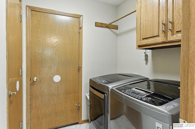 1422 N 155th Ave, Omaha, NE 68154 - laundry area featuring cabinet space and washing machine and clothes dryer