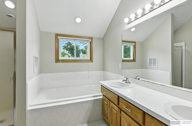 1422 N 155th Ave, Omaha, NE 68154 - full bath with vaulted ceiling, a shower stall, a bath, double vanity, and tile patterned flooring