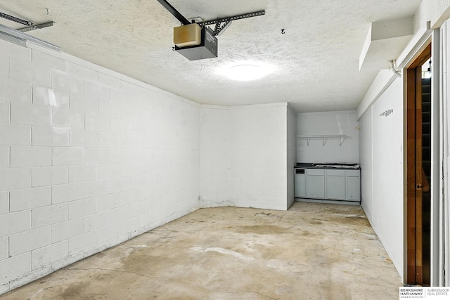 1422 N 155th Ave, Omaha, NE 68154 - garage with a garage door opener and concrete block wall