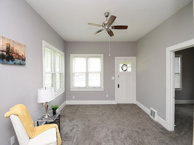95 S Irving St, Fremont, NE 68025 - carpeted foyer featuring a ceiling fan and baseboards