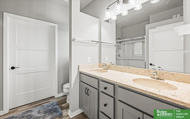 13512 S 55th St, Papillion, NE 68133 - full bath featuring a shower with door, double vanity, and wood finished floors