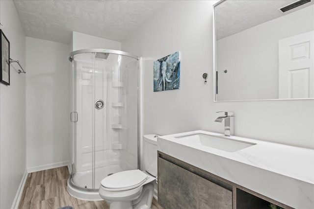 13512 S 55th St, Papillion, NE 68133 - bathroom with a textured ceiling, a shower stall, wood finished floors, and vanity