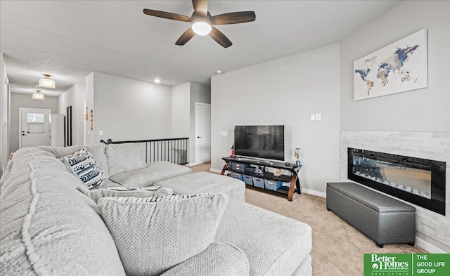 13512 S 55th St, Papillion, NE 68133 - living room featuring ceiling fan, light colored carpet, and a glass covered fireplace