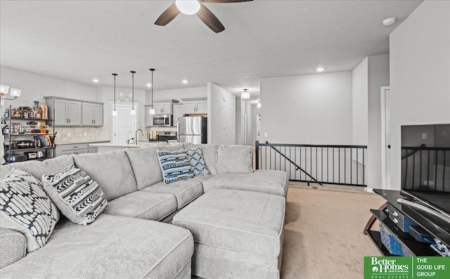 13512 S 55th St, Papillion, NE 68133 - living room with ceiling fan, light colored carpet, and recessed lighting