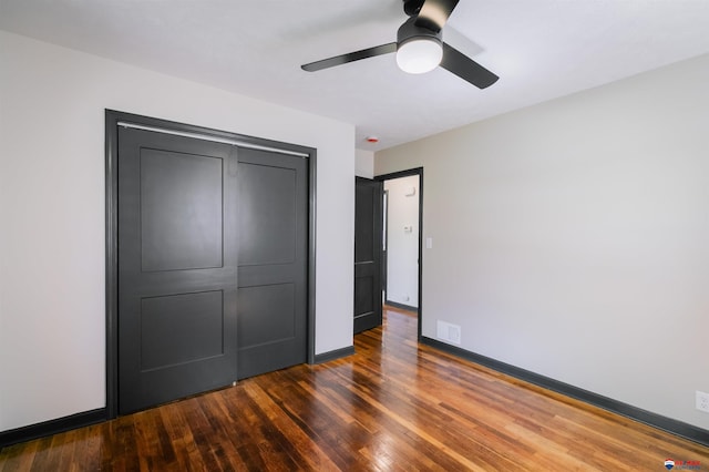 3018 S 42nd St, Lincoln, NE 68506 - unfurnished bedroom featuring wood finished floors, a closet, and ceiling fan