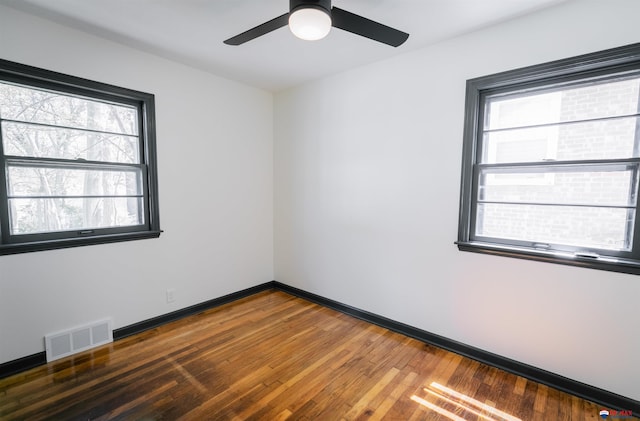 3018 S 42nd St, Lincoln, NE 68506 - spare room with healthy amount of natural light, wood finished floors, and a ceiling fan